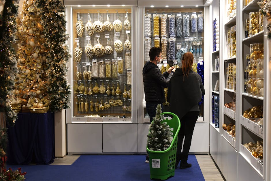 Couple shopping for Christmas ornaments in a festive store setting.
