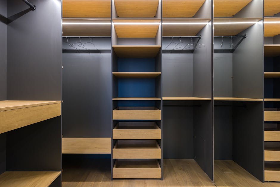 Spacious modern walk-in closet featuring wooden shelving and a sleek design, ideal for organization.
