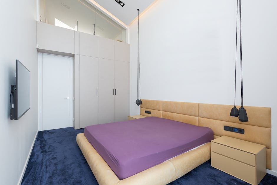 Showcasing a modern minimalist bedroom with stylish decor and furniture.