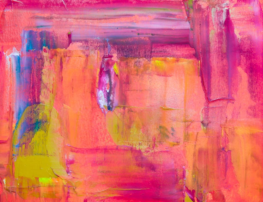 Vivid abstract painting with bold pink, yellow, and blue hues, evoking creativity.