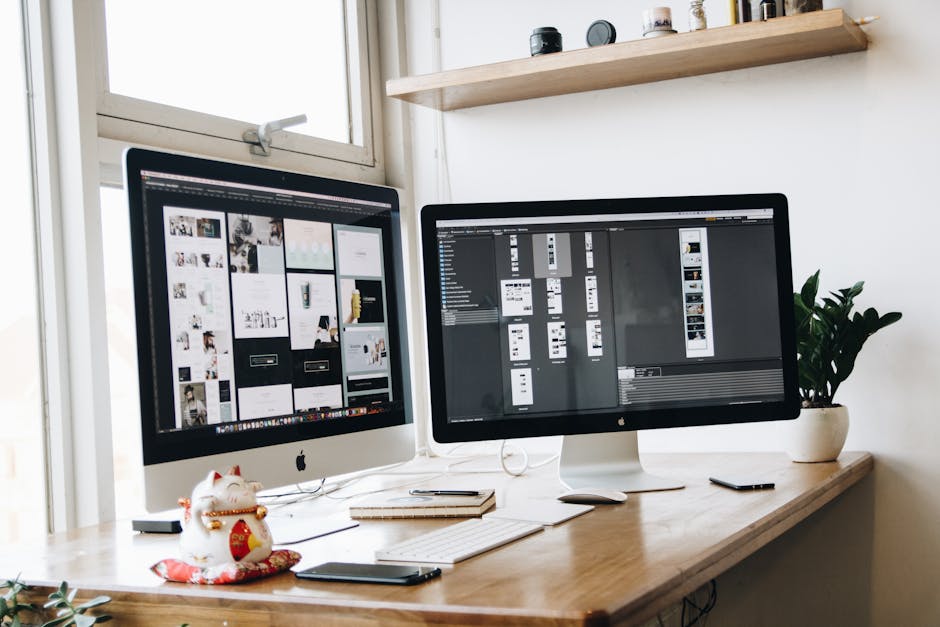 A clean, organized workspace featuring dual monitors, ideal for productivity and creative work.