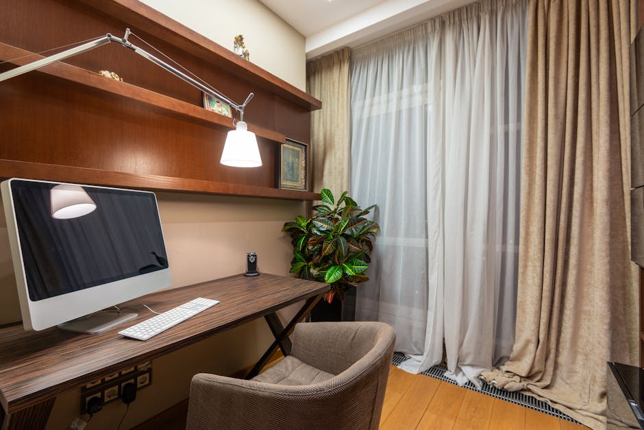 Interior of stylish room with computer placed on wooden table in modern apartment