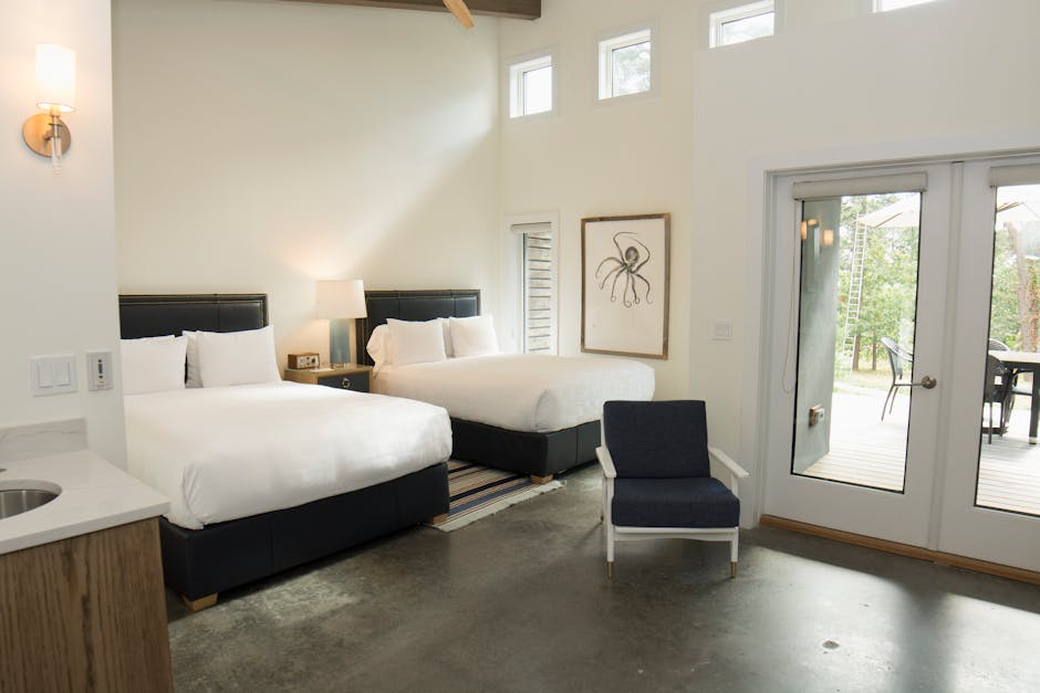 Inviting bedroom with twin beds and contemporary design in Hampton Bays, New York.