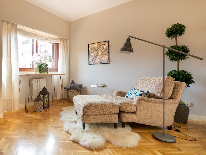 Luxurious living room corner in Madrid featuring a plush lounge chair, rug, and modern decor.